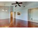 Open floorplan living room with vaulted ceilings, hardwood floors and access to other rooms at 2932 Lichen Ln # D, Clearwater, FL 33760