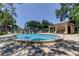 Community pool with clear blue water, lounge chairs, and a cabana for residents to enjoy at 2932 Lichen Ln # D, Clearwater, FL 33760