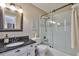 Bathroom with a vanity sink and glass shower door at 3053 S Concordia Ave # A, Tampa, FL 33629