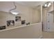 Second floor hallway with art and a view down to the first floor and doorway at 3053 S Concordia Ave # A, Tampa, FL 33629