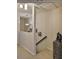 Upstairs hallway featuring unique art, stairs, and a black railing and marbled pedestal at 3053 S Concordia Ave # A, Tampa, FL 33629