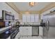 Bright kitchen showcasing stainless steel appliances and modern white cabinetry at 3053 S Concordia Ave # A, Tampa, FL 33629
