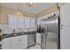 Well-designed kitchen boasts stainless steel appliances and lots of natural light at 3053 S Concordia Ave # A, Tampa, FL 33629