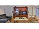 Cozy living room featuring a built-in entertainment center and comfortable seating at 3053 S Concordia Ave # A, Tampa, FL 33629