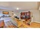 Comfortable living area featuring hardwood floors, a stylish chandelier, and a built-in bookshelf at 3053 S Concordia Ave # A, Tampa, FL 33629