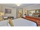 Main bedroom with furnishings and decor throughout, including an en suite bathroom and stairs at 3053 S Concordia Ave # A, Tampa, FL 33629