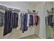 Walk-in closet with ample storage space and organized hanging clothes at 3053 S Concordia Ave # A, Tampa, FL 33629