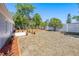 Spacious backyard with wood mulch, garden beds and privacy fencing at 3401 Truman Dr, Holiday, FL 34691