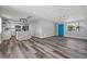 Open floor plan with a bright blue door and modern kitchen at 3401 Truman Dr, Holiday, FL 34691