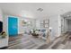 Bright living room with neutral walls, wood floors, and a comfortable seating area with coastal decor at 3401 Truman Dr, Holiday, FL 34691