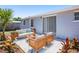 Outdoor patio area with comfortable seating and well-manicured landscaping around at 3401 Truman Dr, Holiday, FL 34691