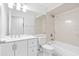 Bathroom features vanity sink, toilet and a tiled shower and tub combination at 4208 W Flora St, Tampa, FL 33614