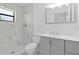 Bright bathroom features modern vanity, white marble tile shower, and updated fixtures at 4208 W Flora St, Tampa, FL 33614