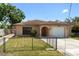 Charming single-story home with a stone facade, well-maintained lawn, and inviting curb appeal at 4208 W Flora St, Tampa, FL 33614