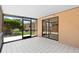 Large screened patio featuring neutral colored stucco and tile flooring perfect for relaxing at 4208 W Flora St, Tampa, FL 33614