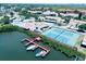 Community aerial view showcasing the pool, tennis courts, and boat docks along the water at 4360 Outrigger Ln, Tampa, FL 33615