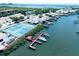 Community aerial shot featuring tennis courts, boat docks, and beautiful waterfront homes at 4360 Outrigger Ln, Tampa, FL 33615