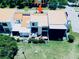 Aerial view of a home with a patio, surrounded by green spaces in a residential community at 4360 Outrigger Ln, Tampa, FL 33615