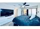 Comfortable bedroom with a large bed, TV, and access to a bathroom at 4360 Outrigger Ln, Tampa, FL 33615