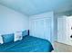 Cozy bedroom with a closet, plush bed, and warm lighting at 4360 Outrigger Ln, Tampa, FL 33615