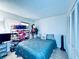 Comfortable bedroom with ample closet space, a plush bed, and a window at 4360 Outrigger Ln, Tampa, FL 33615