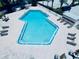 An aerial view showcases the pool with ample space for lounging in this gorgeous community at 4360 Outrigger Ln, Tampa, FL 33615