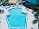 The aerial view showcases the pool with ample space for lounging in this gorgeous community at 4360 Outrigger Ln, Tampa, FL 33615