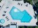 An aerial view showcases the pool with ample space for lounging in this gorgeous community at 4360 Outrigger Ln, Tampa, FL 33615