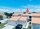 Inviting home featuring a well-maintained exterior, showcasing a garage and tidy landscaping at 4360 Outrigger Ln, Tampa, FL 33615
