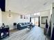 Comfortable living room with modern gray sofa, stylish decor, and high ceilings at 4360 Outrigger Ln, Tampa, FL 33615