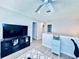 Cozy loft area with a ceiling fan, television, and modern furniture at 4360 Outrigger Ln, Tampa, FL 33615