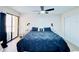Inviting main bedroom with stylish decor, a ceiling fan, and a spacious closet at 4360 Outrigger Ln, Tampa, FL 33615