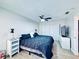 Inviting main bedroom with stylish decor, a ceiling fan, and a spacious closet at 4360 Outrigger Ln, Tampa, FL 33615
