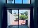 View of outdoor patio area featuring stylish furniture and views of the lush landscaping at 4360 Outrigger Ln, Tampa, FL 33615