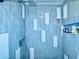 Modern tiled shower with sleek fixtures and convenient built-in shelving at 4360 Outrigger Ln, Tampa, FL 33615