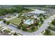 Aerial view of the community pool, surrounding neighborhood, and lush landscaping at 4583 Barletta Ct, Wesley Chapel, FL 33543