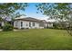 View of the backyard, landscaping, and exterior of the home at 4583 Barletta Ct, Wesley Chapel, FL 33543