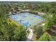 Aerial view of the well-maintained basketball court with blue and green painted surface at 4583 Barletta Ct, Wesley Chapel, FL 33543