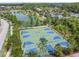 Aerial view of a basketball court by a lake and residential area at 4583 Barletta Ct, Wesley Chapel, FL 33543