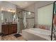 Bright bathroom with a soaking tub, stand-up shower, modern vanity, and ample counter space at 4583 Barletta Ct, Wesley Chapel, FL 33543