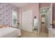 Bedroom with butterfly wallpaper, a large closet, desk and a mirror at 4583 Barletta Ct, Wesley Chapel, FL 33543