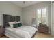 This bedroom has a large window with shutters and a modern design at 4583 Barletta Ct, Wesley Chapel, FL 33543