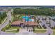 Expansive community pool area with slides, parking, and lush landscaping in a Gathering-friendly neighborhood at 4583 Barletta Ct, Wesley Chapel, FL 33543