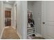 Hallway with a shoe rack and entry to the laundry room at 4583 Barletta Ct, Wesley Chapel, FL 33543