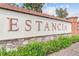 The stone community signage with 'Estancia' in elegant lettering, surrounded by lush landscaping at 4583 Barletta Ct, Wesley Chapel, FL 33543