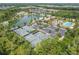 Aerial view of four tennis courts near the lake, pool and clubhouse at 4583 Barletta Ct, Wesley Chapel, FL 33543