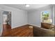 Charming bedroom featuring wood floors, large windows, and soothing gray walls at 475 28Th N Ave, St Petersburg, FL 33704