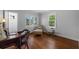 Cozy bedroom with hardwood floors, lots of windows, and a comfortable seating area at 475 28Th N Ave, St Petersburg, FL 33704