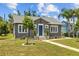 Charming home showcasing a blue front door, classic details, and inviting curb appeal at 475 28Th N Ave, St Petersburg, FL 33704
