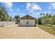 Large two-car garage with brick driveway and manicured landscaping at 475 28Th N Ave, St Petersburg, FL 33704